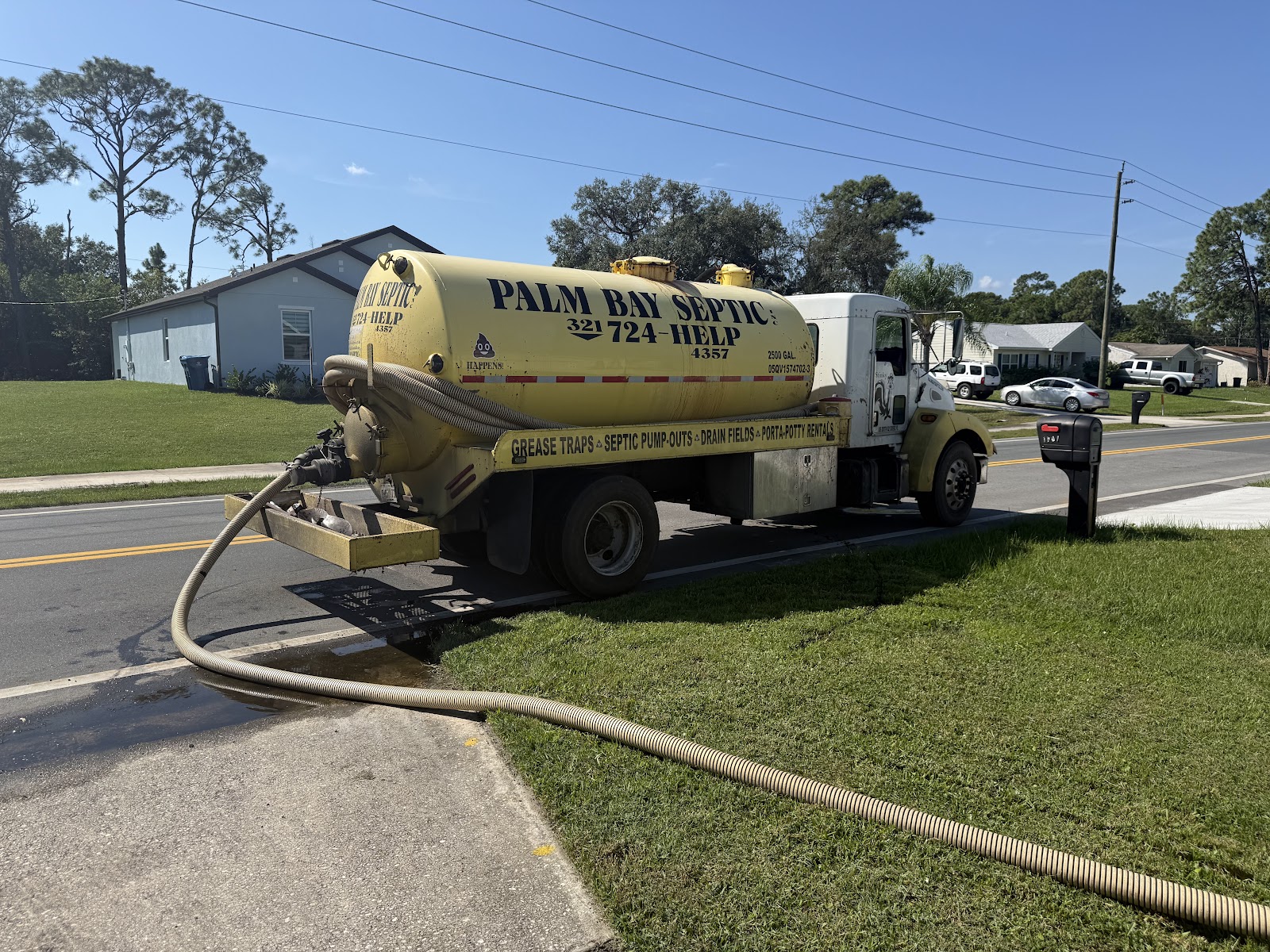 Palm Bay Septic pump truck pumping a residential septic tank in Malabar, Florida