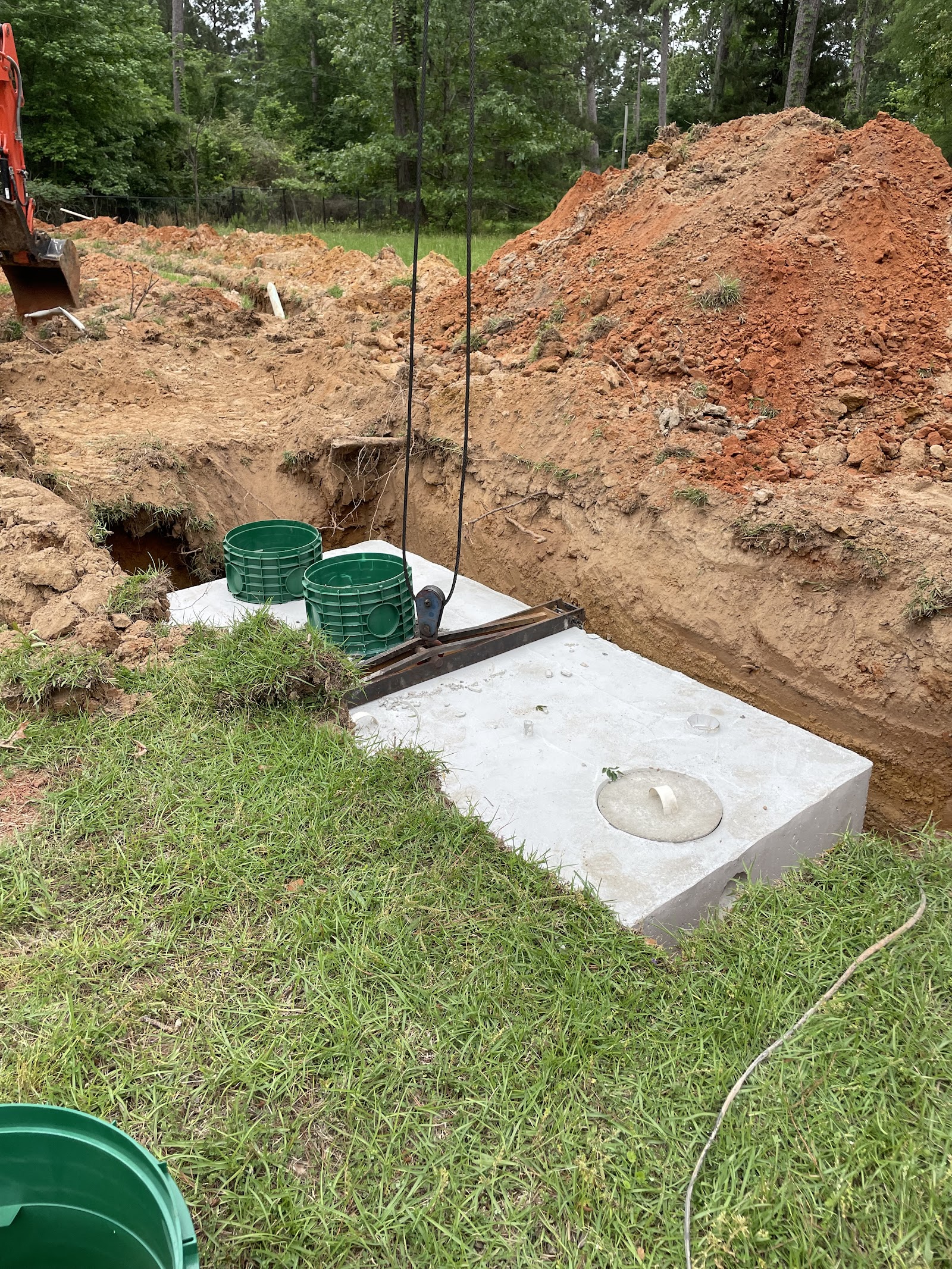 Septic tank concrete lid installation in a Bossier City residential yard
