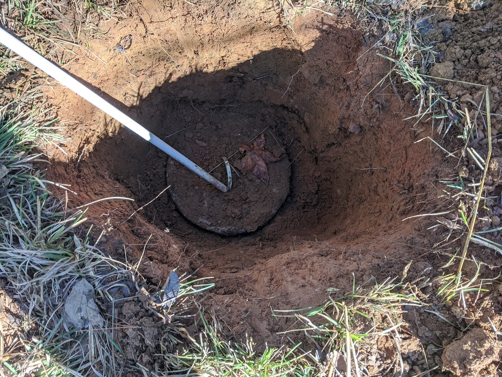 Exposed septic tank lid during a system inspection in the Bossier City area