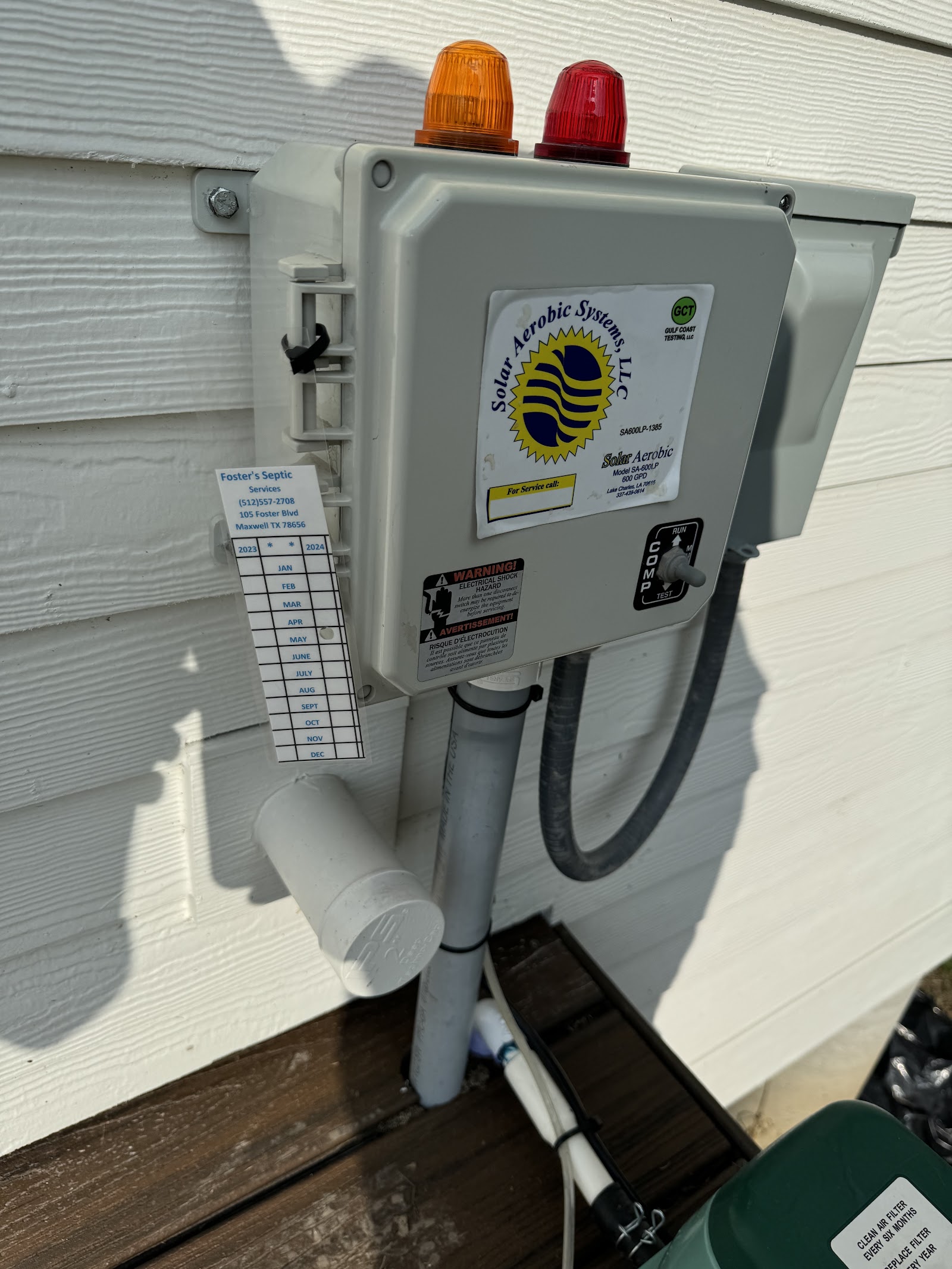 Solar Aerobic Systems septic treatment control panel mounted on residential exterior wall