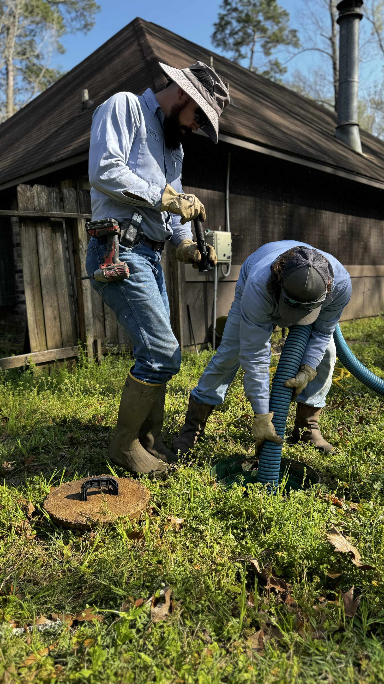 Brighteyes Septic technicians performing septic tank pumping at a residential property