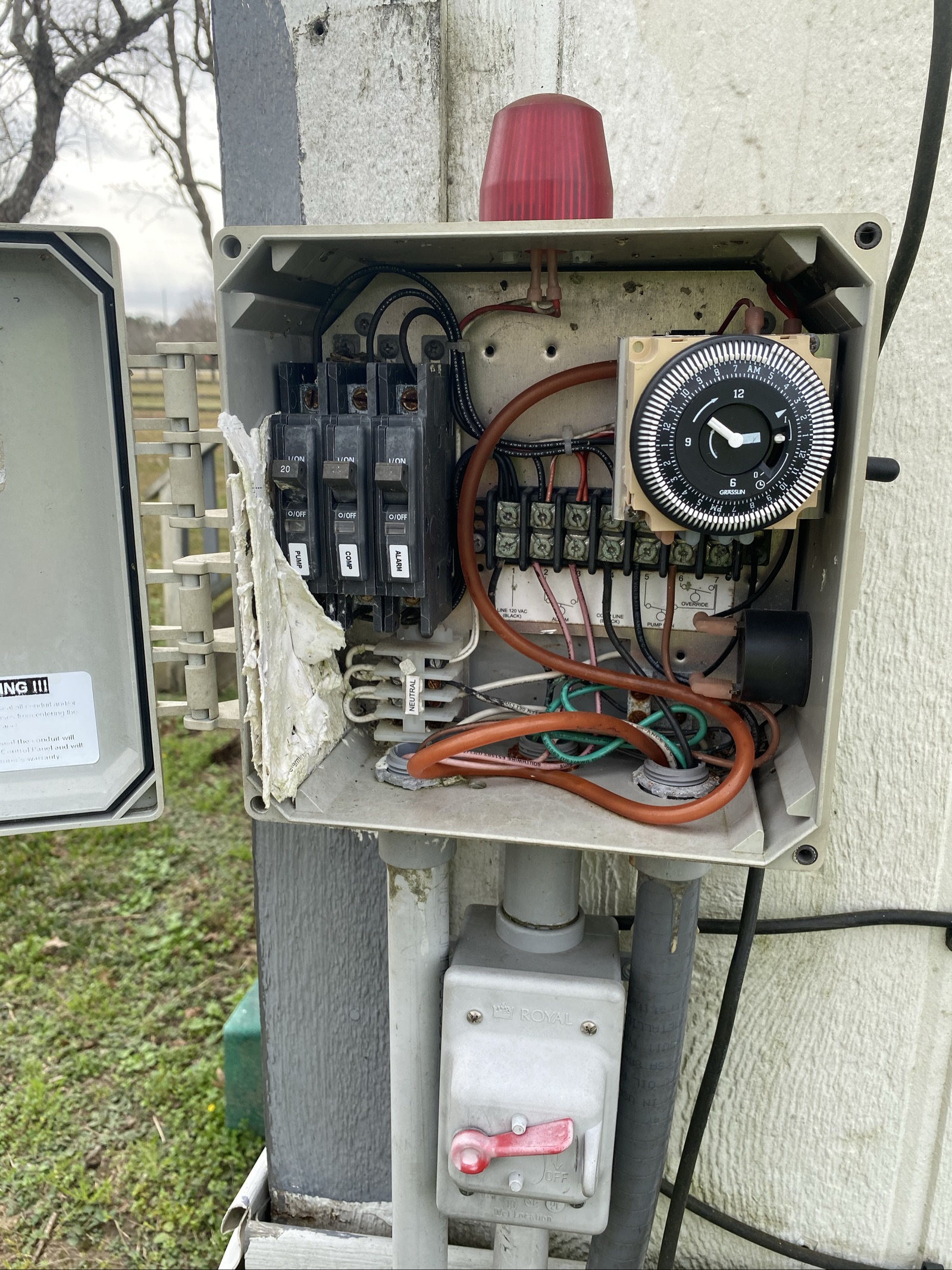 Aerobic septic control box with timer, breakers and wiring inspected during a maintenance visit