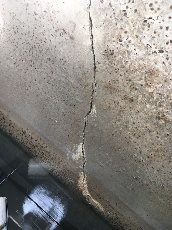 The outer wall of this aerobic unit is cracked, you can see the sand pouring in from outside